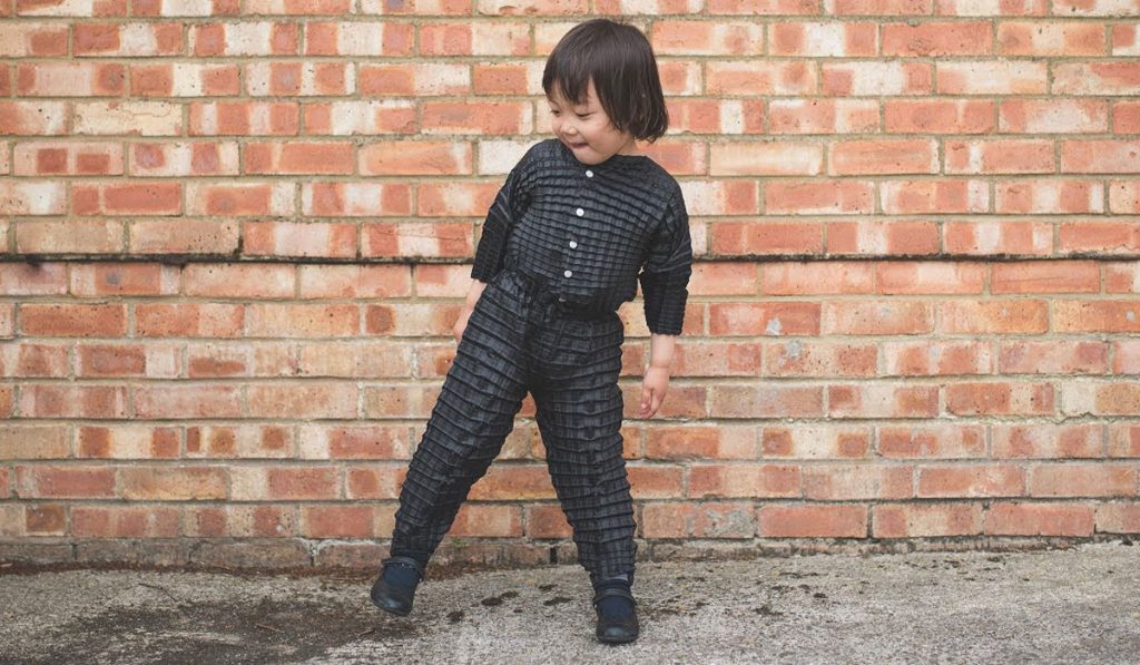 Ryan Yasin's, Petit Pli - Origami-inspired range of children’s clothing made from a durable pleated fabric that expands to fit growing babies.